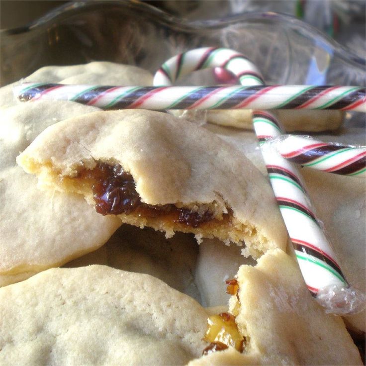 several pastries with candy canes in the background