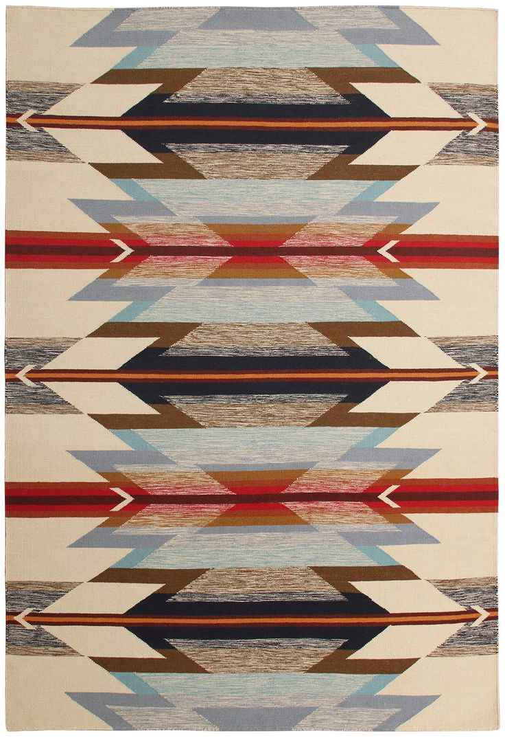 a multicolored rug with an arrow pattern on the front and back side, in various colors