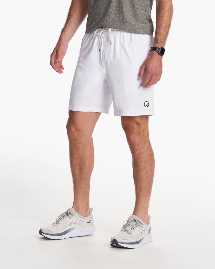 One short for every sport, the Kore Shorts have a classic athletic fit, falling just above the knee with an anywhere and everywhere versatility. Go commando in confidence with the breathable, boxer-brief liner. | Vuori Kore Shorts | White | XXL Vuori makes premium performance apparel inspired by the active Coastal California lifestyle; an integration of fitness, surf, sport, and art. Breaking down the boundaries of traditional activewear, we are a new perspective on performance apparel. Functional White Moisture-wicking Athletic Shorts, White Athletic Shorts With 4-way Stretch For Sports, White 4-way Stretch Athletic Shorts For Sports, Sporty Gym Athletic Shorts With 5-inch Inseam, White Go-dry Sports Shorts, White Functional Athletic Shorts For Workout, Functional White Athletic Shorts For Workout, White Functional Running Shorts, Sporty Shorts With Elastic Waistband For Light Sports