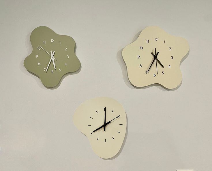 Welcome! These are our new and improved Amoeba Clocks. They are thicker and better quality than the previous version of our clocks after taking feedback from our customers! We hope you enjoy- thanks for looking. Dimensions: -Cream 1: Width: 10 inches  Height: 10 and 3/4 inches -Cream 2: Width: 11 and 5/8 inches  Height: 11 inches -Green Width: 9 inches  Height: 10 and 1/2 inches 3/4 of an inch thick, weighs 2 lbs They all have hooks on the back for hanging. Non-ticking mechanism. Requires one AA Ceramic Watch Wall, Ceramic Wall Clock, Ceramic Clock, Alphabet Activities Kindergarten, Pastel Walls, Clay Diy Projects, Pottery Handbuilding, Ceramic Watch, Pottery Crafts