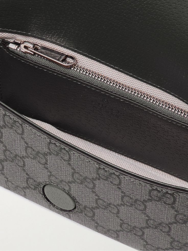 Gucci's 'Ophidia' bag has achieved cult status since its release in 2018. This mini version is crafted from coated-canvas printed with signature 'GG' motif and trimmed with leather. It's perfectly sized to hold the essentials like your phone, cardholder and keys. Luxury Crossbody Bag In Signature Coated Canvas, Luxury Signature Coated Canvas Crossbody Bag, Luxury Signature Coated Canvas Satchel Shoulder Bag, Designer Crossbody Bag In Signature Coated Canvas, Designer Signature Coated Canvas Crossbody Bag, Formal Shoulder Bag With Removable Pouch In Monogram Canvas, Luxury Monogram Canvas Clutch Bag, Formal Monogram Canvas Shoulder Bag With Removable Pouch, Business Bags With Removable Pouch In Signature Coated Canvas