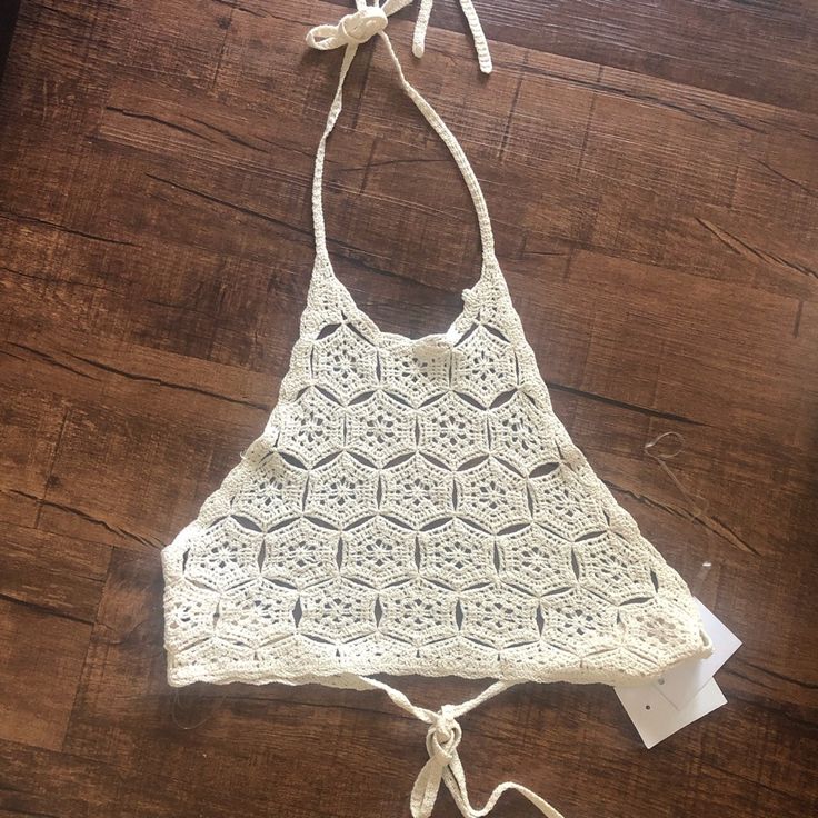 Brand New With Tags, Women’s Crocheted Halter Top. Chic White Crochet Top For Summer, White Crochet Lace Top For Beach Season, Cream Crop Top For Summer Beach, White Hollow Out Top For Beach, White Crochet Top For Spring Party, Spring Cream Crop Top For Beach, Cream Crop Top For Beach In Spring, Spring Beach Cream Crop Top, Summer White Halter Top For Party