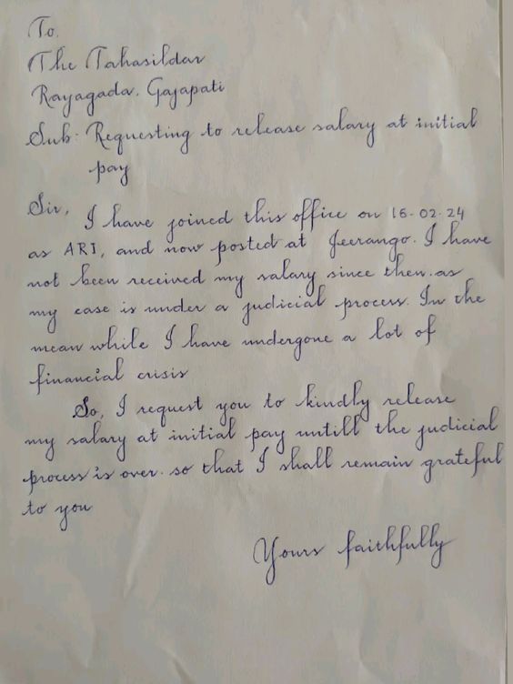 a handwritten letter written in cursive ink on white paper with blue writing