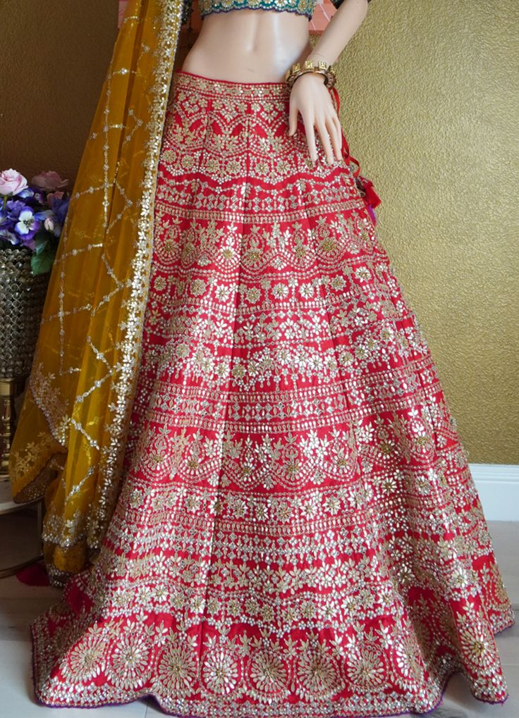 Off late, tri-color color blocking has become a raging sensation. If your obsession with everything off-beat matches ours, then you have landed to the right outfit. This gorgeous lehenga with exuberant zardozi and gota work boosting with accents of reds, yellows and greens is as dreamy as a lehenga can be. Perfect for any occasion ranging from weddings to festivities. Color -Green, Red and Yellow Fabric & Work Style -- Lehenga: Silk fabric with zardozi and gota work.- Dupatta: Net fabric wit Lehenga Silk, Gorgeous Lehenga, Indian Bridal Couture, Indian Bridesmaid Dresses, Celebrity Closet, Indian Bridal Lehenga, Gota Work, Indian Bride And Groom, Lehenga Saree