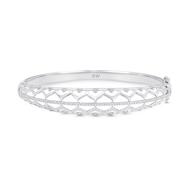 Contemporary arabesque shapes charm the eye and create a lovely frame for this horizontal bangle. Set in supple 18k yellow, rose, or white gold, a row of Round Cut pave diamonds and scattered prong-set diamonds add sparkle all around its edges for a sophisticated bling effect. Fine Jewelry Designers, Bangle Set, Arabesque, Yellow Rose, Pave Diamonds, Online Jewelry, Prong Setting, Round Cut, Silver Bracelet