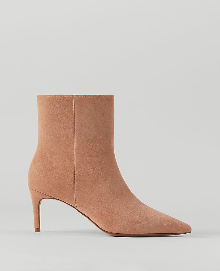 Elevate your style with the Ann Taylor Stiletto Suede Bootie, a perfect blend of sophistication and comfort. 

- Size: 7 1/2
- Color: Dominican Sand
- Material: Leather
- Gender: Female
- Features: Pointy toe, inside zip, padded footbed
- Heel Height: 2 1/2 inches

These booties are meticulously crafted from rich suede, featuring a sleek stiletto heel and a pointy toe that adds a touch of elegance to any outfit. The inside zip allows for easy wear while the padded footbed ensures comfort through Chic Suede Boots With Zipper Closure, Female Features, Sleek Fashion, Style Statement, Shoes Booties, Toe Designs, Suede Booties, Easy Wear, Stiletto Heel