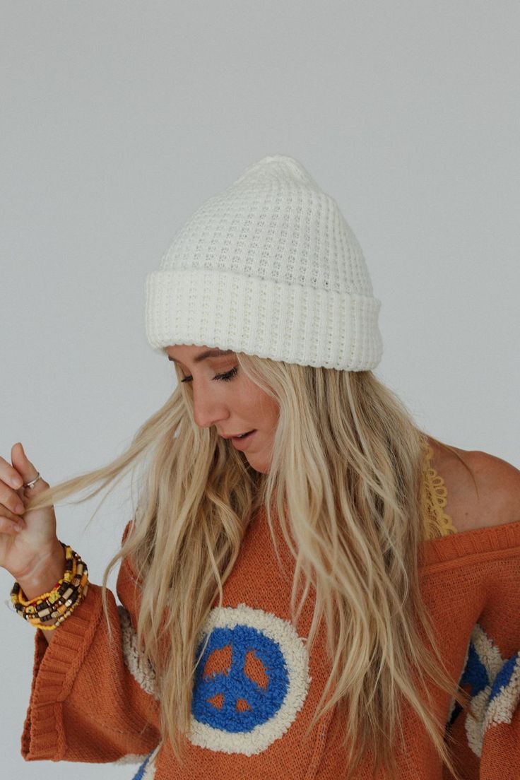 Get ready for the effortlessly cool and classic touch of the Maybelle Waffle Beanie—the perfect addition to your cool-weather wardrobe! Cozy waffle knit fabric Fitted beanie silhouette Fold over edge detail Perfect essential boho finish! Pair with: Eye Of The Sun Padded Bralette, Ethereal Shine Stacked Bracelet and Dreamscape Layered Necklace. *Due to lighting and differences in monitors, actual colors may vary slightly from what appears online. Model is 5'4" and wearing a size OS. Approximate m White Cozy Beanie For Cold Weather, Cozy White Beanie For Cold Weather, White Fall Beanie One Size Fits Most, White Fall Beanie One Size, White Cotton Hats For Cold Weather, Beige Soft Knit Crochet Hat For Fall, Warm Cozy White Crochet Hat, White Beanie One Size Fits Most For Fall, White Beanie For Fall, One Size Fits Most