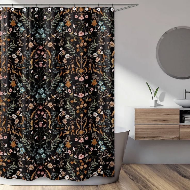 a black shower curtain with colorful flowers on it