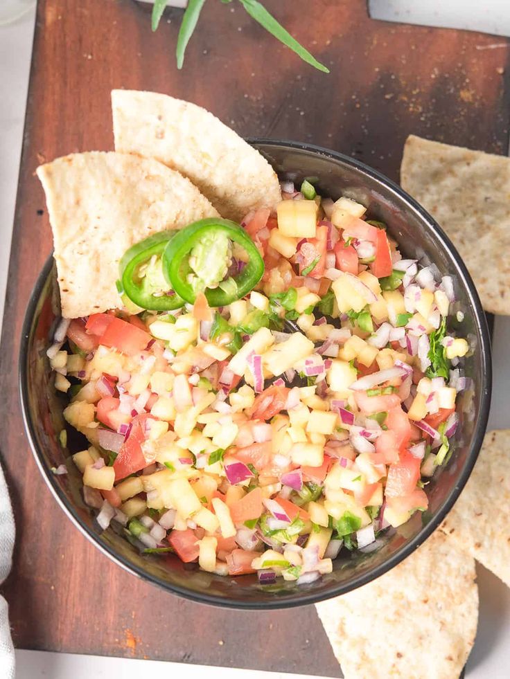 a bowl filled with salsa and tortilla chips