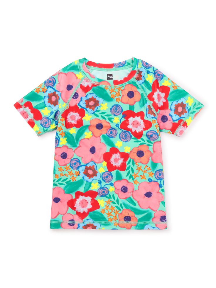 Abloom in brilliant flowers, our popular short sleeve rash guard offers UPF 50+ protection from the sun. Mix & match with Tea's bikini bottoms or swim trunks.