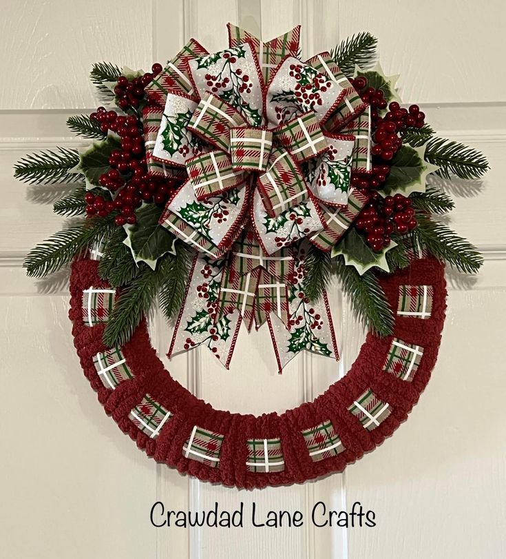 a christmas wreath hanging on the front door