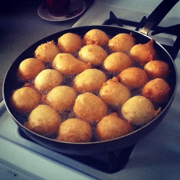 a pan filled with food sitting on top of a stove next to a burner