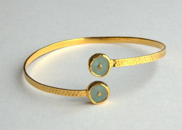 #14kgold bangle, featuring Sonia's signature symbol of the sun in #blueopal #finejewelry #bangles Hammered Gold Bracelet Gift, Hammered Bangle Bracelet For Anniversary, Modern Hammered Bracelet For Anniversary, Luxury Hammered Bracelets As Gift, Luxury Hammered Bracelets For Gift, Hammered Yellow Gold Bracelets As Gift, Luxury Hammered Bracelets Gift, Hammered Yellow Gold Bracelets Gift, Modern Hammered Round Bracelets