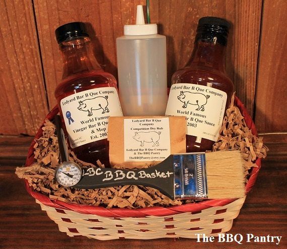 the bbq gift basket is filled with barbecue sauces and condiments