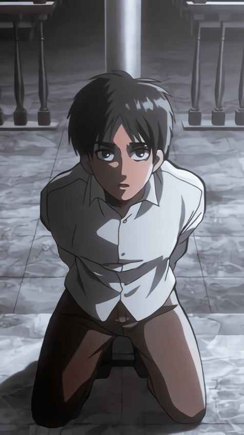 an anime character sitting on the ground with his arms crossed