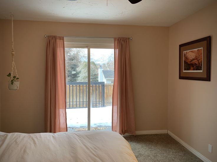 the bedroom is clean and ready for us to use it's own sliding glass door