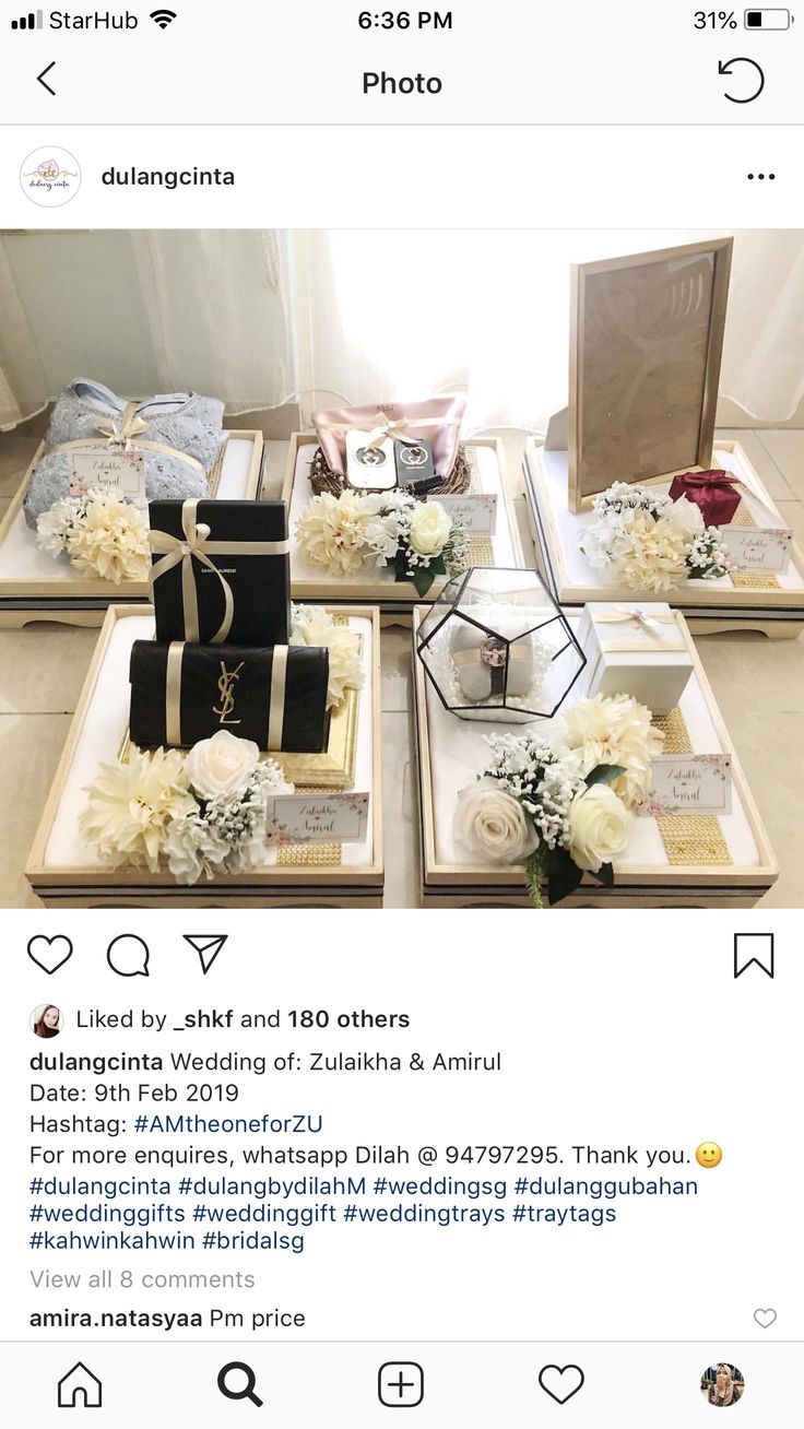 four square trays with flowers and jewelry on them, all decorated in black and white