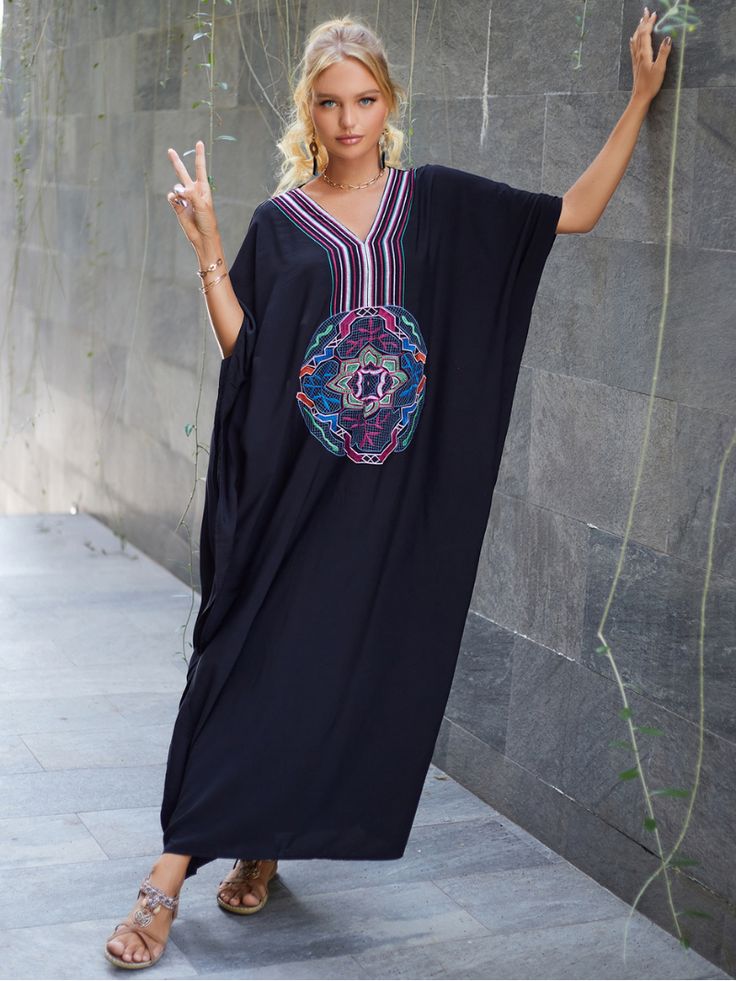 The "All You Need Women's Rayon Black Kaftan Dress" is a stylish and versatile garment designed specifically for women. Made from high-quality rayon fabric. this kaftan dress offers a luxurious and comfortable feel against the skin. The dress features a classic black color. which adds an element of sophistication and elegance to any outfit.With its loose and flowy design. the kaftan dress provides a relaxed and effortless fit. making it suitable for various body types. It is designed to be worn Black Kaftan Dress, Morrocan Fashion, Embroidered Robe, Black Kaftan, Beach Wardrobe, Stylish Loungewear, Embroidered Robes, Beach Kaftan, Plus Size Beach