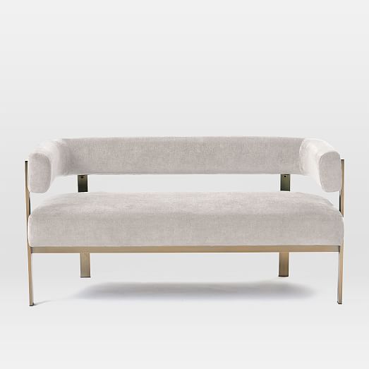 a white couch sitting on top of a wooden frame