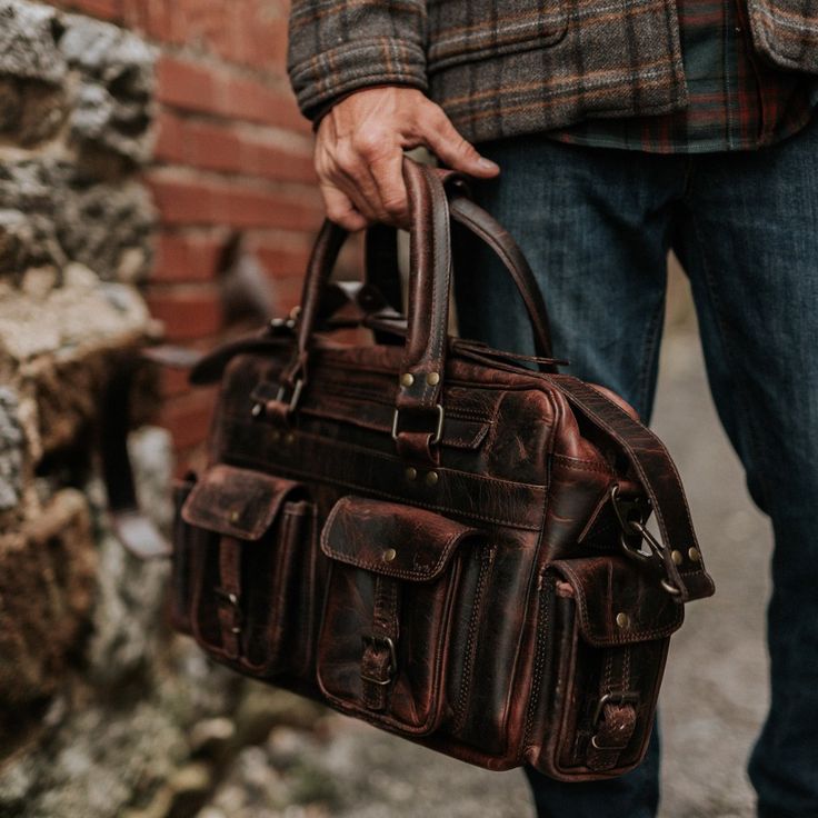 Vintage Leather Pilot Bag - Large | Dark Oak side Rugged Everyday Bag With Pockets, Rugged Bags With Pockets For Everyday Use, Rugged Everyday Bags With Pockets, Leather Duffle Bag With Pockets For Overnight Trips, Functional Leather Satchel With Pockets, Practical Leather Shoulder Bag With Pockets, Functional Business Bags With Multiple Pockets, Practical Leather Bag For Everyday Carry, Rugged Satchel Bag With Luggage Sleeve