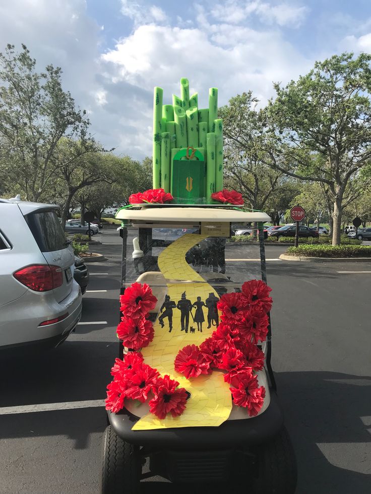 a golf cart decorated with red flowers and decorations