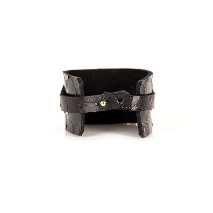 Leather bracelet made of two layers of premium black Italian leather. The Buckle Black Leather Cuff has an adjustable double-snap closure. This unique artisanal handmade cuff is a distinctive fashion statement to any wardrobe. This bracelet is a great gift for women. DETAILS 1.57" width 7" length Double Snap Closure Black Gold Plated Buckle 100% genuine Italian Leather Handmade Made in USA Adjustable Leather Cuff Bracelet With Bracelet Strap, Adjustable Leather Bracelet With Strap, Adjustable Leather Wristband With Bracelet Strap, Adjustable Leather Bracelet With Wrist Strap, Adjustable Leather Strap Wristband Bracelet, Adjustable Leather Strap Wristband, Adjustable Leather Wristband For Everyday, Luxury Adjustable Leather Bracelet For Everyday Wear, Leather Jewelry With Wrist Strap For Everyday Wear