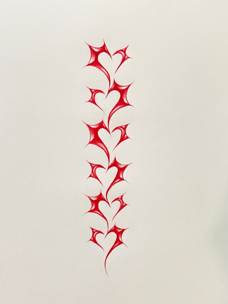 a drawing of a red flower on a white wall