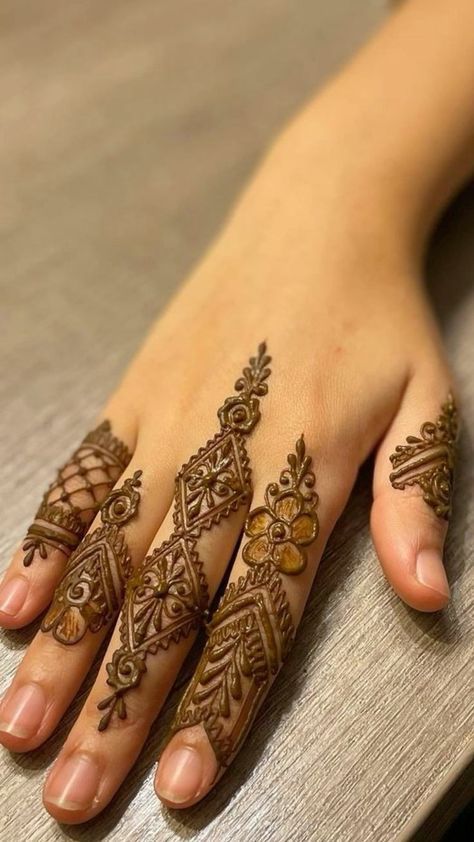 hendi tattoos on the hands of a woman