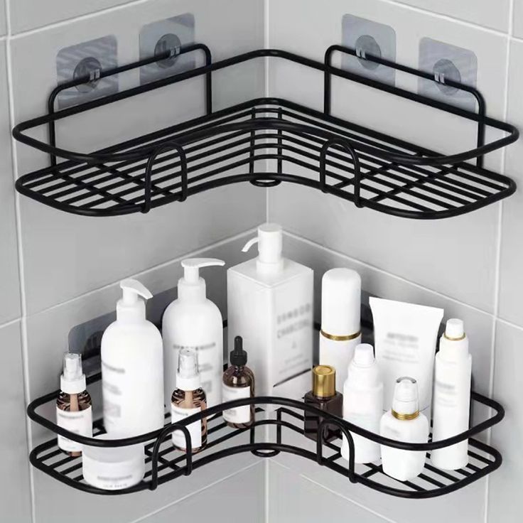 a corner shelf with several bottles and soaps on it in a bathroom area that is tiled