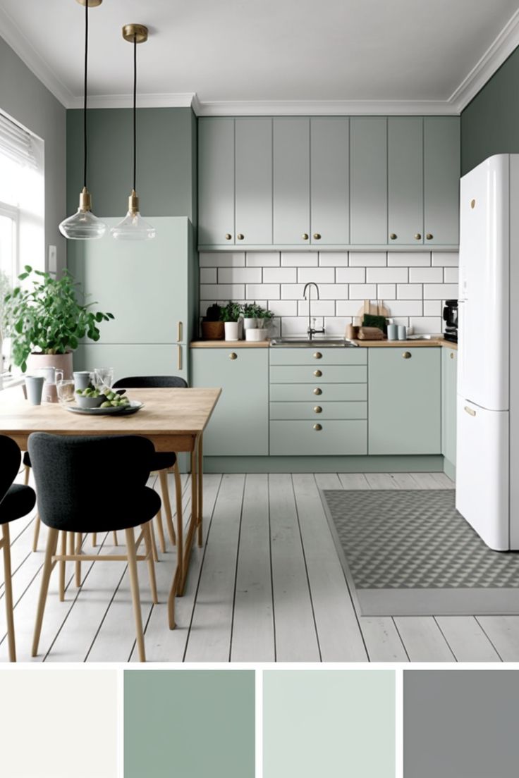 an image of a kitchen with green and white colors in it's walls, including the cabinets