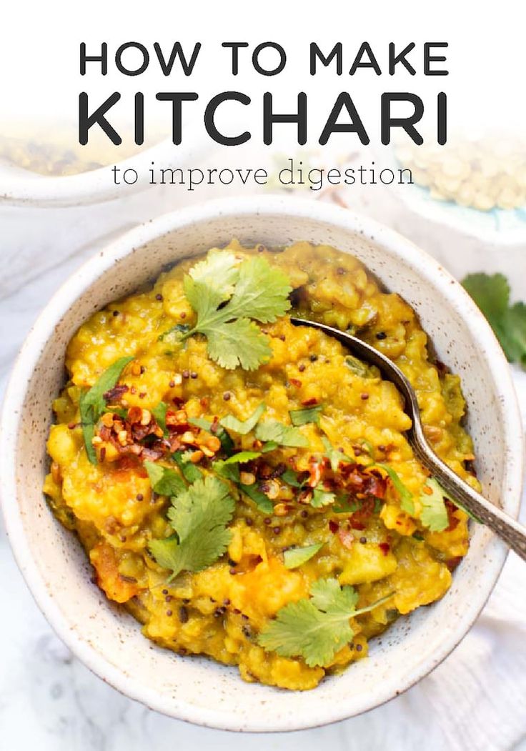 a white bowl filled with yellow rice and cilantro garnished with cilantro