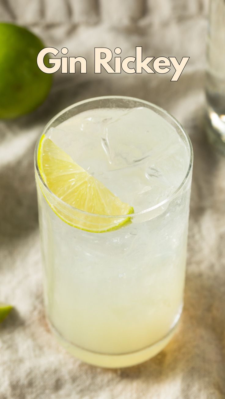 the gin rickey cocktail is garnished with lime