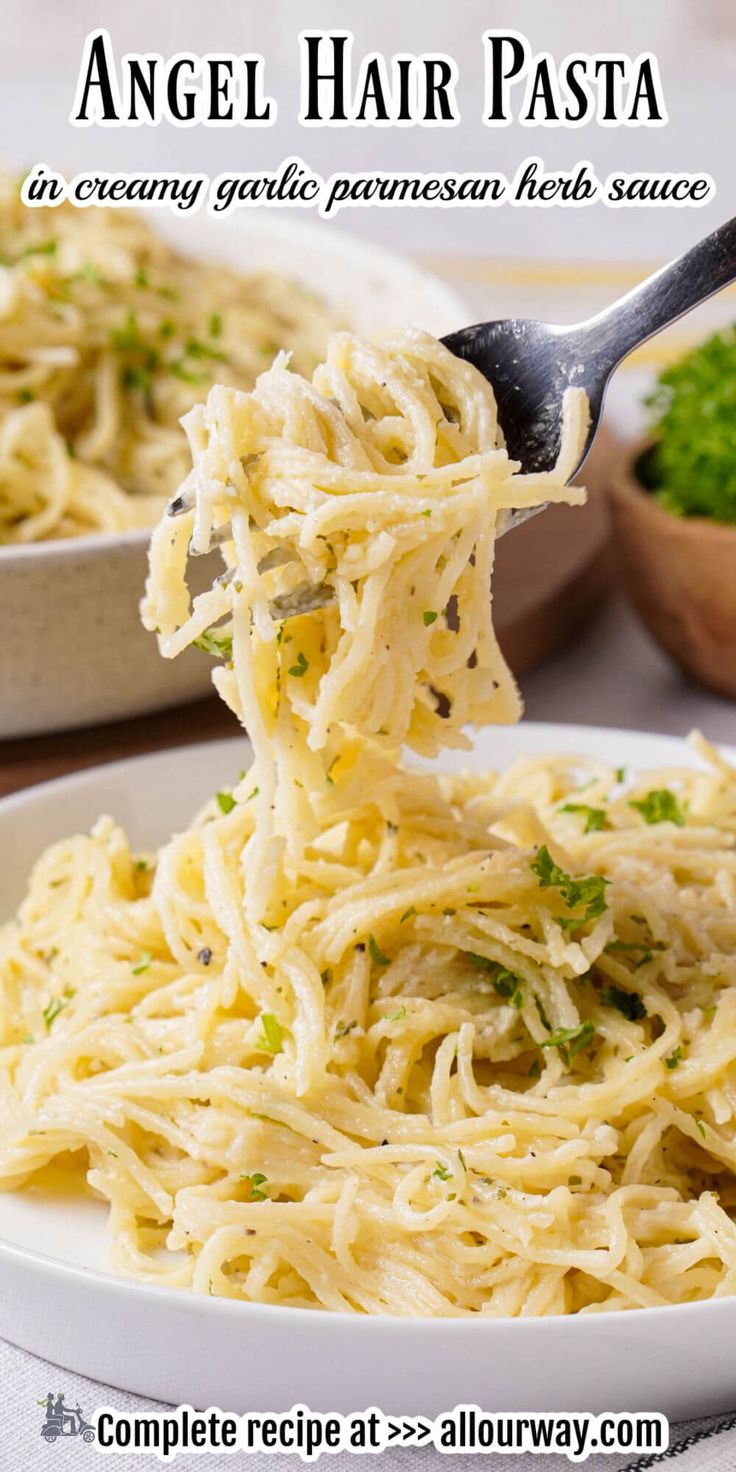 a spoonful of angel hair pasta on a white plate with parmesan herbs