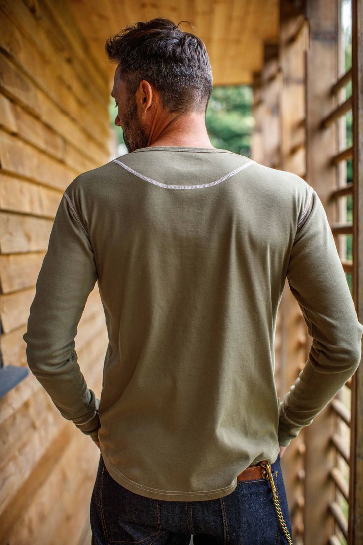 Traditional styling comes into its own with this classic Elder Henley Shirt made from single jersey 100% natural raw cotton. Full-length sleeves, turn up fabric cuffs and three-button neck opening to create this authentic Henley Shirt.  Features:  - Full-length sleeves with turn-up cuffs  - Reverse-out stitching - Colour-matched branded buttons - Scooped hem - Classic neck-opening with three buttons  - Overlock top stitch secures bottom shirt trim - Cotton Placket Try not to wash cotton too often. Wash at no more than 30c. Do not tumble dry Son Clothes, Raw Denim Jeans, Baker Boy Hat, Work Wear Outfits, Stocking Fillers For Her, Fabric Cuff, Henley Shirt, Raw Denim, Pullover Shirt