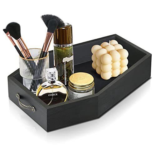 a black tray with makeup and other items in it on a white background, there is no image here to provide a caption for