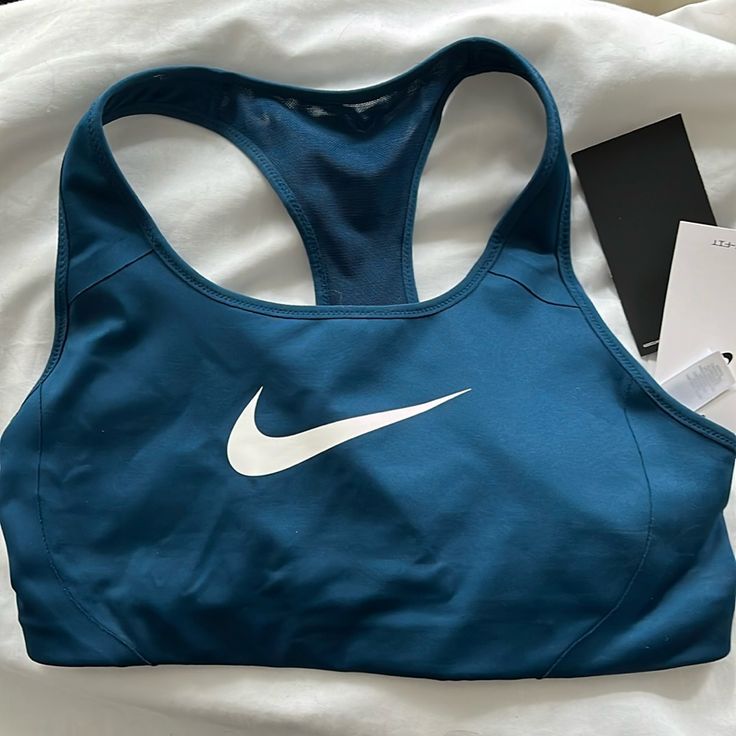 Nwt Never Worn Blue Sports Bra With Medium Support For Running, Blue Sports Bra For Running With Medium Support, Sporty Blue Sports Bra With Light Support, Blue Sleeveless Activewear For Sports Events, Blue Sports Bra With Light Support, Blue Sporty Sports Bra With Light Support, Blue Sports Bra With Medium Support, Blue Sports Bra For Gym, Blue Sports Bra With Medium Support For Sports Season