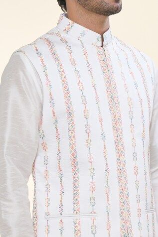 Off white solid kurta. Paired with a Nehru Jacket with thread embroidery and a matching plain mexican pant. - Aza Fashions White Sherwani With Chikankari Embroidery For Spring, Spring White Sherwani With Chikankari Embroidery, White Cotton Nehru Jacket For Festive Occasions, White Chikankari Embroidery Outerwear For Eid, Festive White Cotton Nehru Jacket, White Traditional Bandhgala For Spring, White Bandhgala With Chikankari Embroidery For Spring, White Cotton Sherwani For Spring, White Embroidered Fitted Nehru Jacket