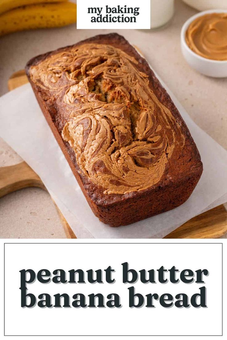 a loaf of peanut butter banana bread sitting on top of a cutting board next to some bananas