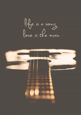 an acoustic guitar with the words life is a song love is the music