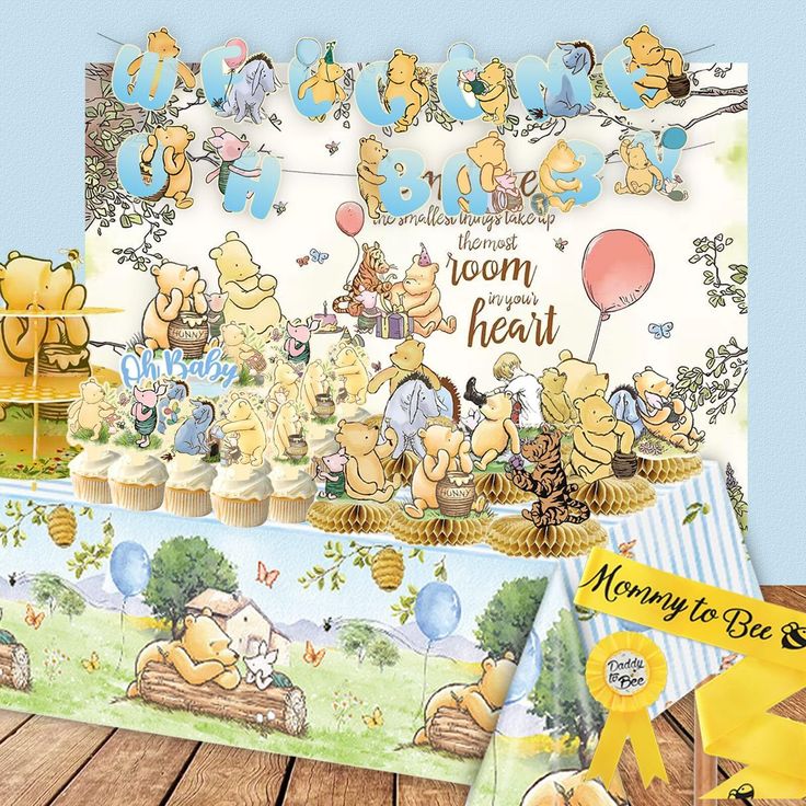 winnie the pooh themed birthday party with decorations and table cloths, including cupcakes