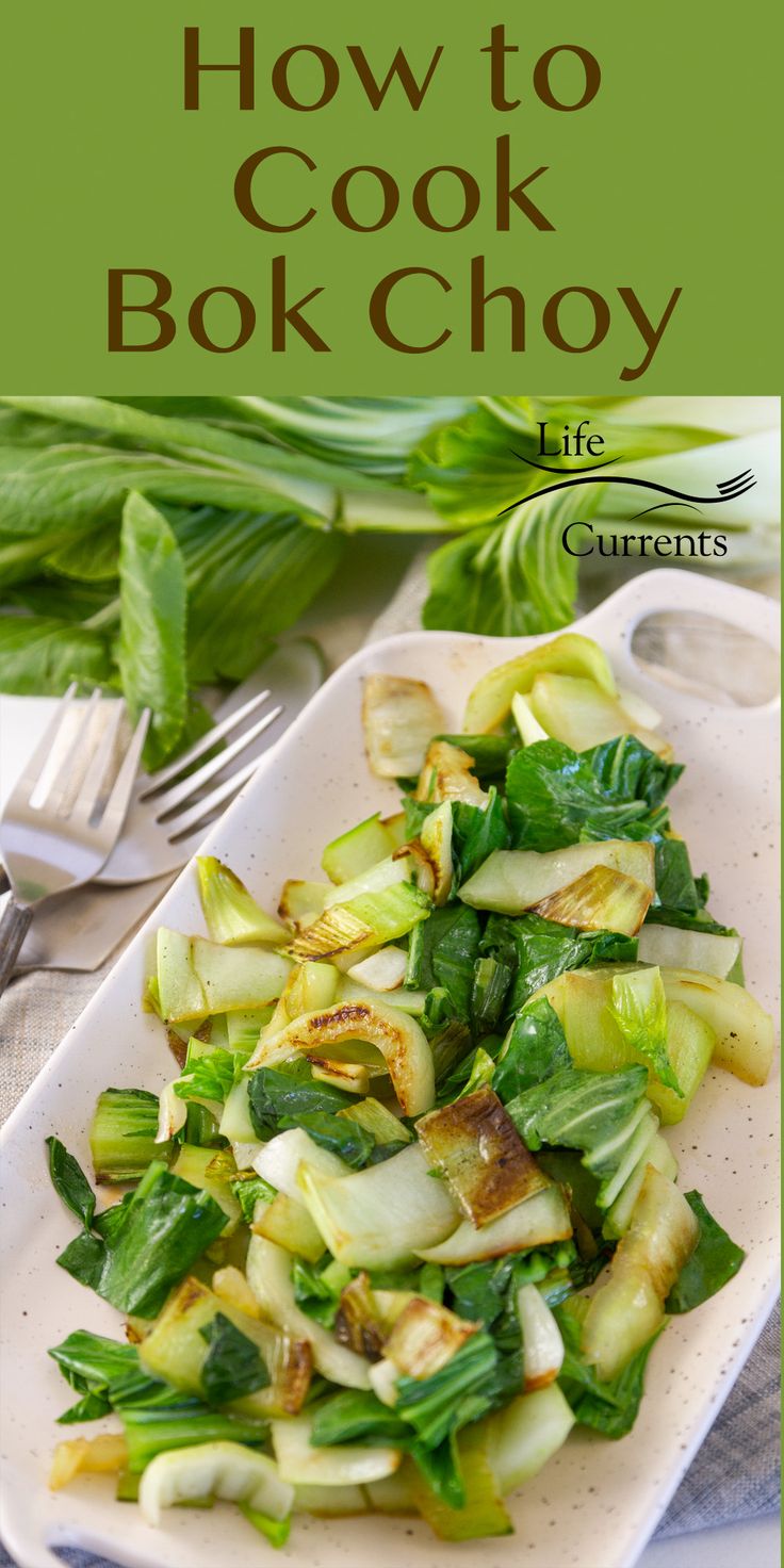 a white plate topped with green vegetables next to a fork