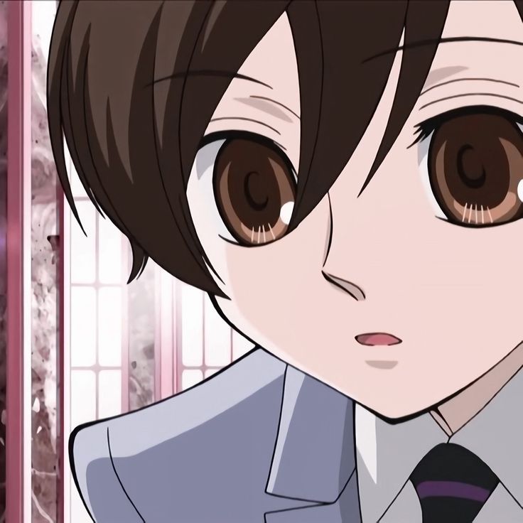 an anime character with brown eyes wearing a suit and tie, looking at the camera