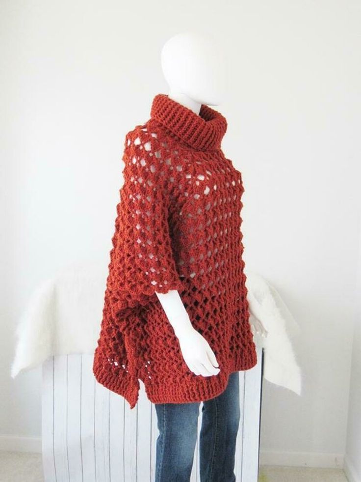 a mannequin wearing a red knitted sweater