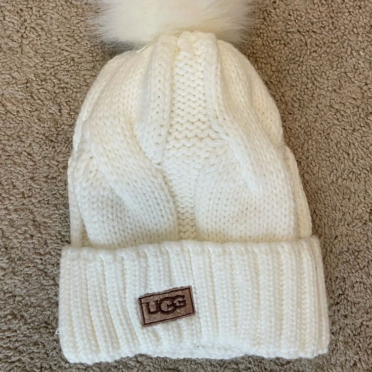 White Ugg Winter Hat - Never Worn. Trendy White Beanie One Size, Trendy Warm White Hat, Trendy White Hat For Fall, Trendy White Warm Hats, White Hats For Fall, One Size, Trendy White Winter Hat, White One-size Hats For Fall, White Hats For Fall, Trendy Fitted White Beanie