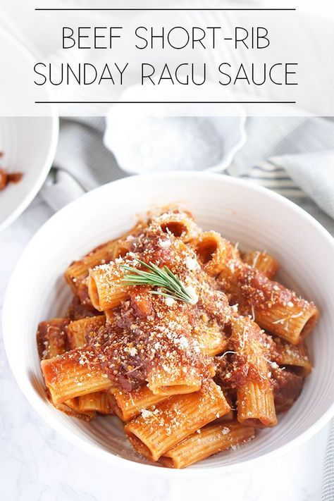 two bowls filled with pasta covered in sauce and parmesan cheese on the side