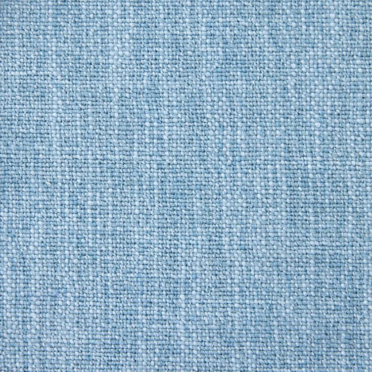 a blue fabric textured with small white dots