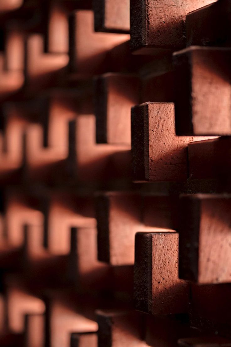 the wall is made up of wooden blocks