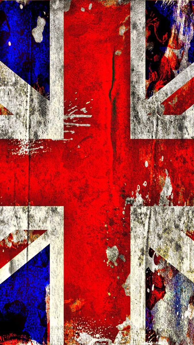 the british flag is painted on an old, grungy wall with peeling paint