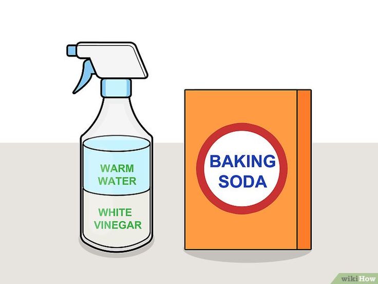 a bottle of baking soda next to a box with the words baking soda written on it