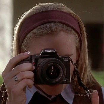 a woman taking a photo with her camera